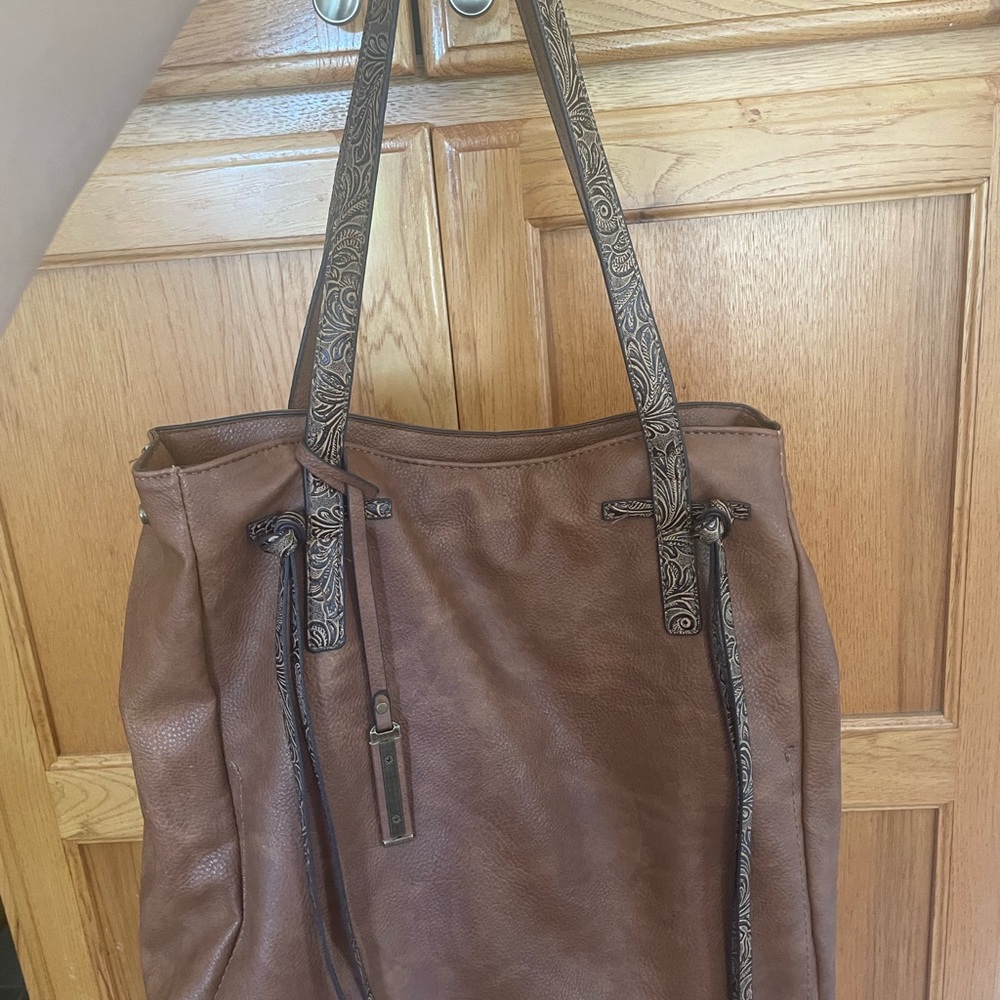 Darcy Marks leather tote bag with embossed straps